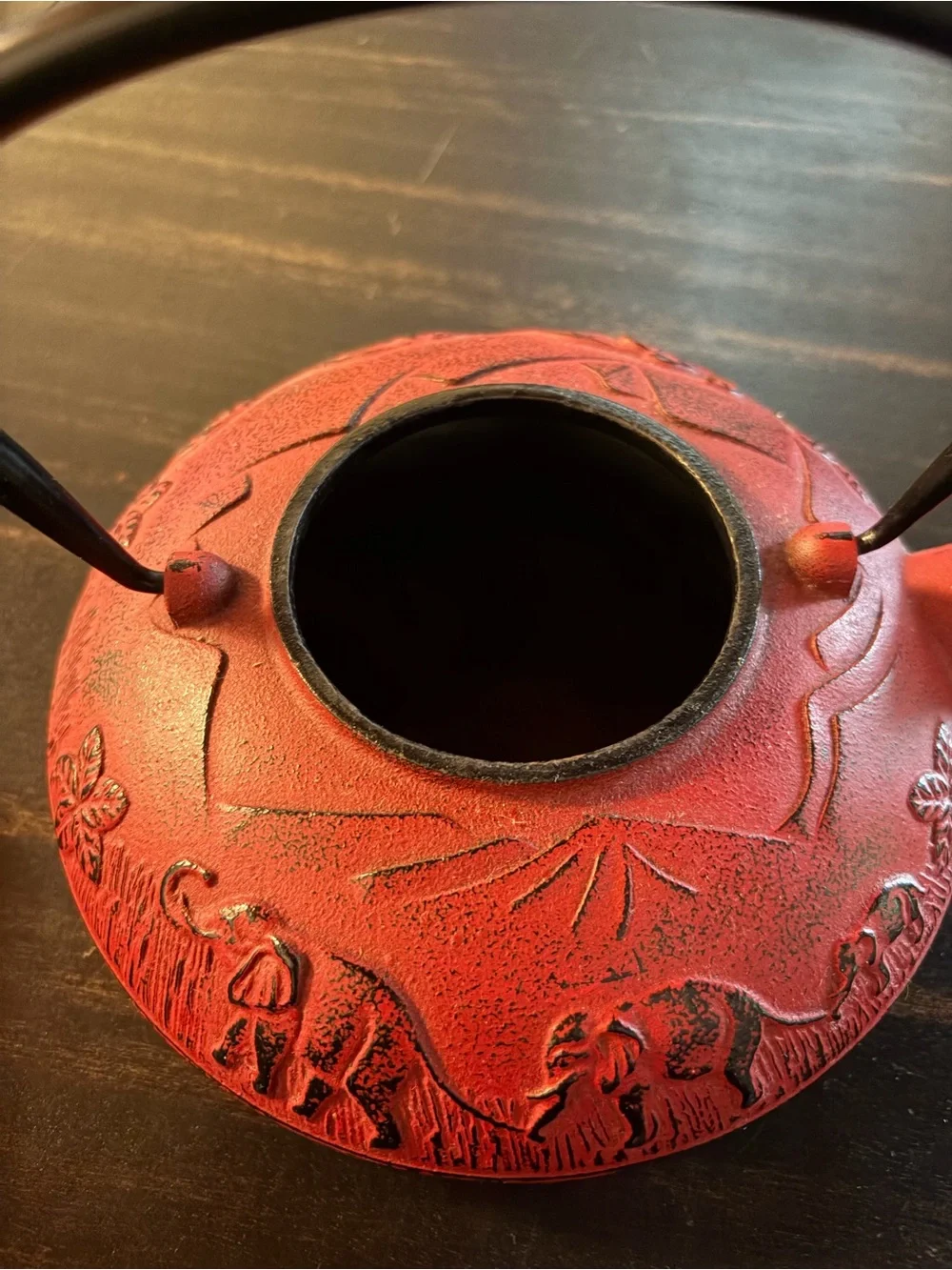 Red cast iron tea kettle